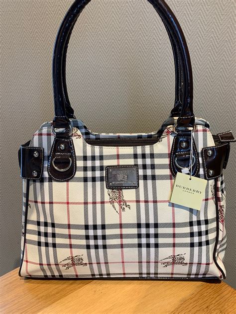 burberry bag black label|Burberry blue label purses.